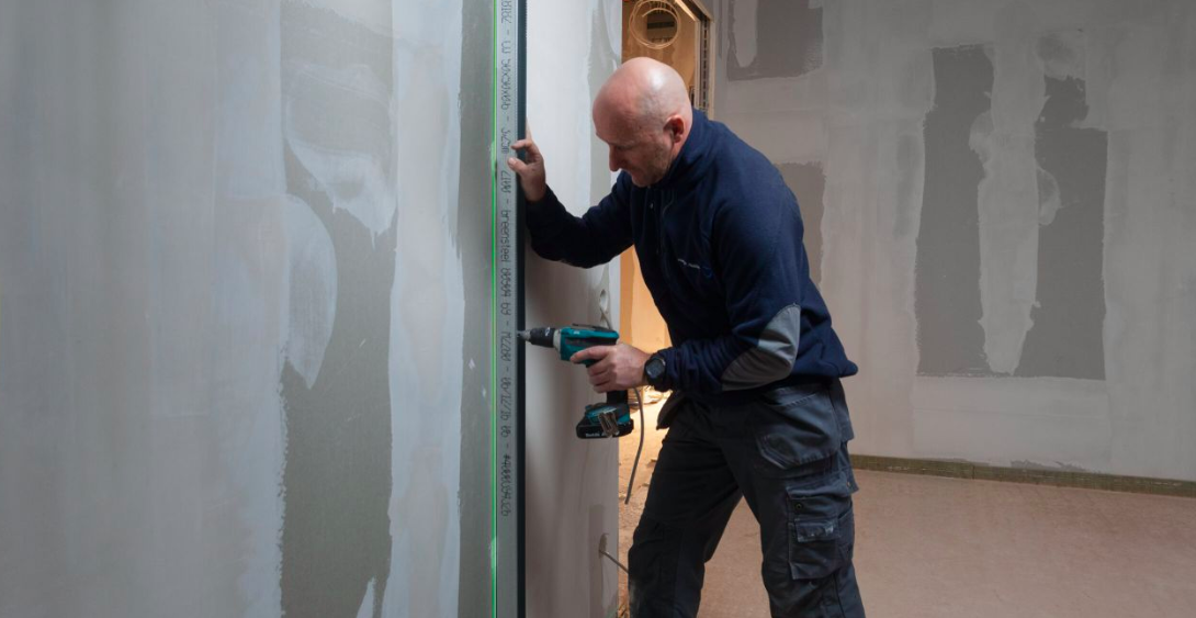 Worker Drilling Stabila